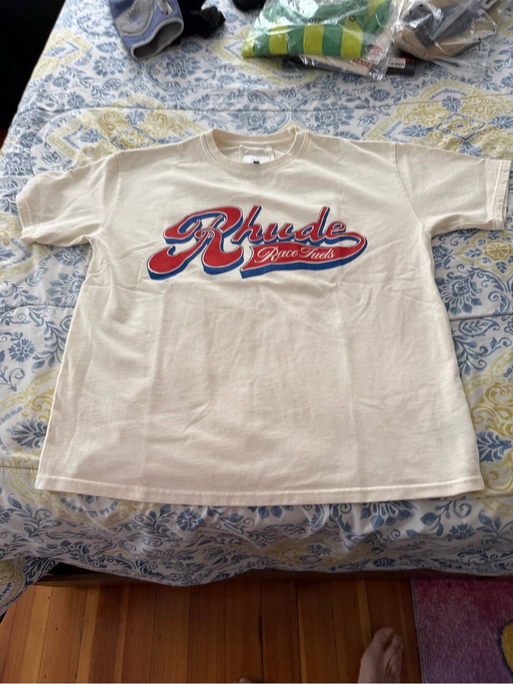 Rhude Men’s Cream Tee with Red and Blue Script Logo